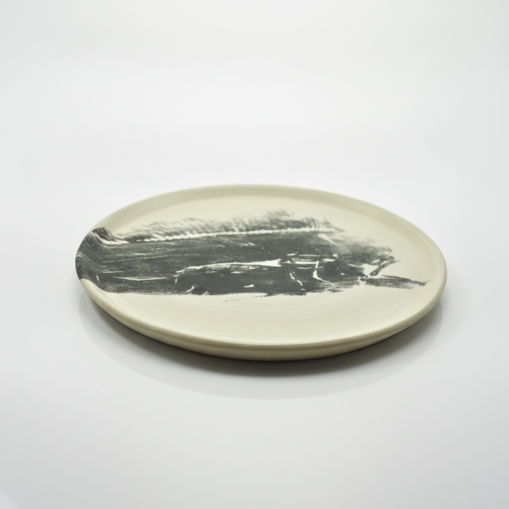Damar Dorado Head Dinner Plate black print, studio product photo